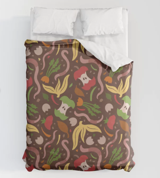 bed with two pillows and patterned comforter